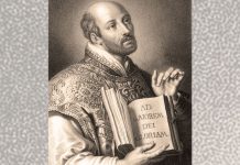 St. Ignatius with AMDG in book