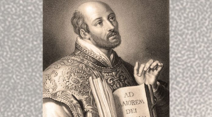 St. Ignatius with AMDG in book