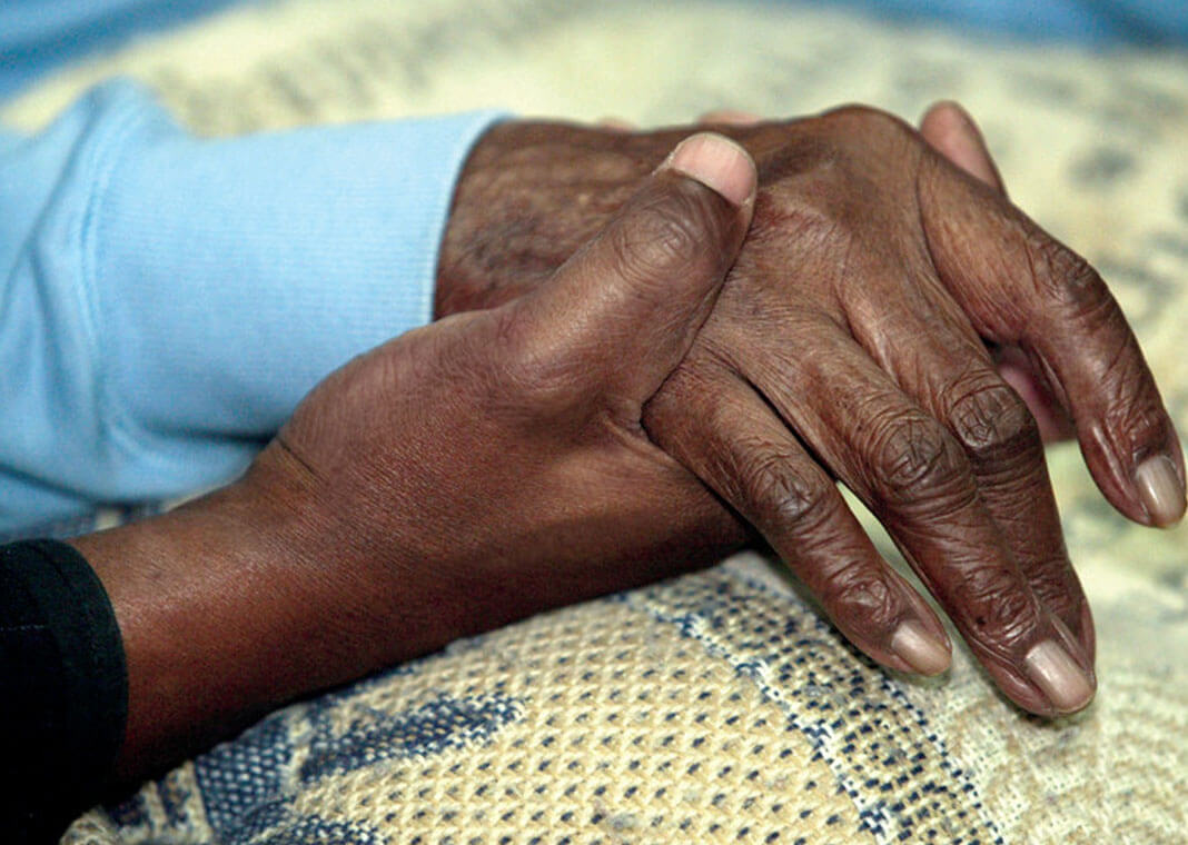 holding hand of an elder