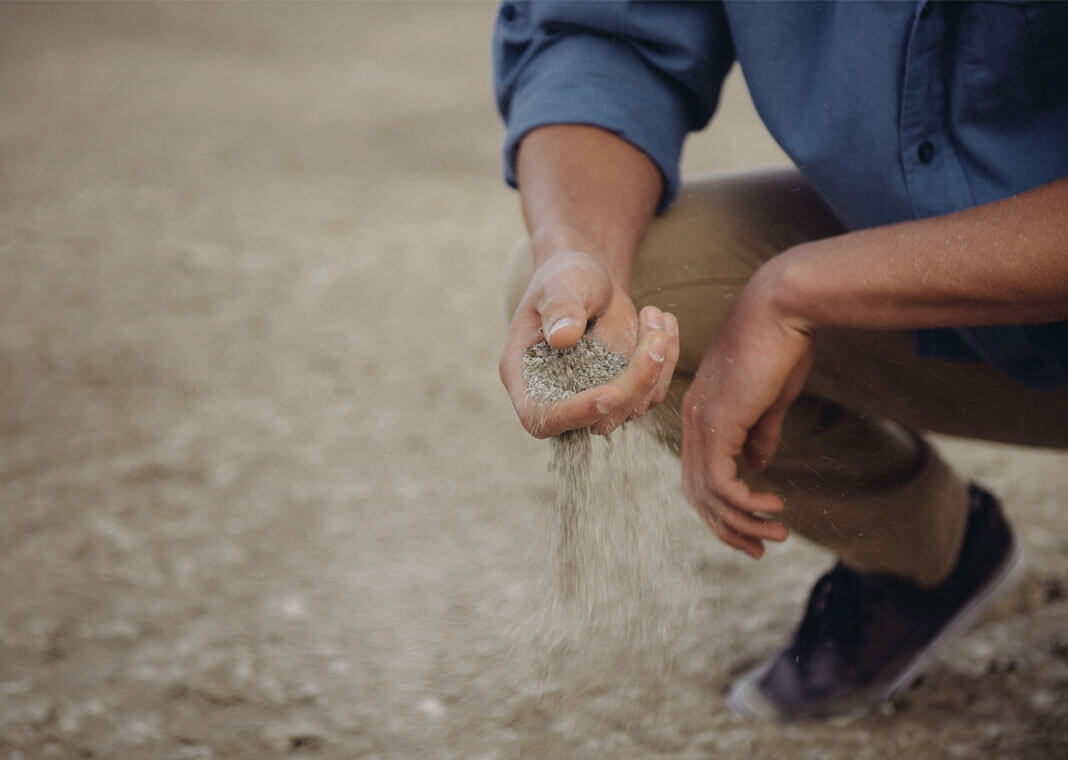 sand running through fingers - photo by Forrest Cavale on Unsplash
