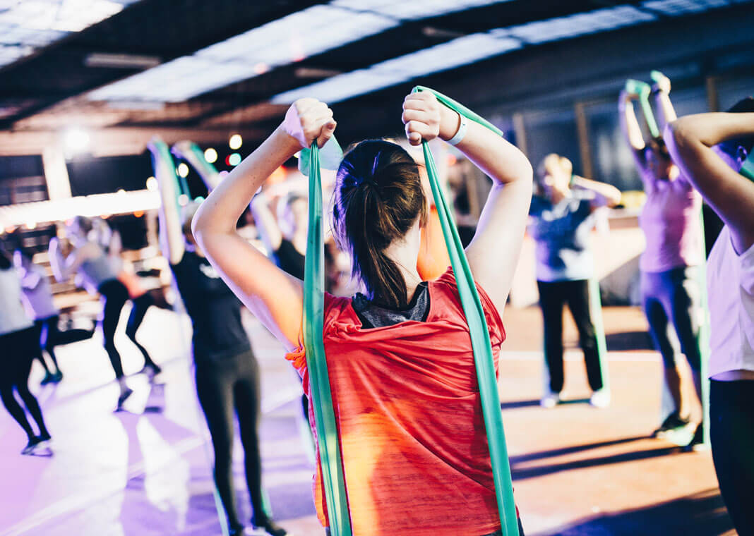 resistance training in a fitness class - photo by Geert Pieters on Unsplash