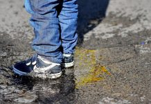 child standing in puddle - image by Lutz Holzapfel from Pixabay