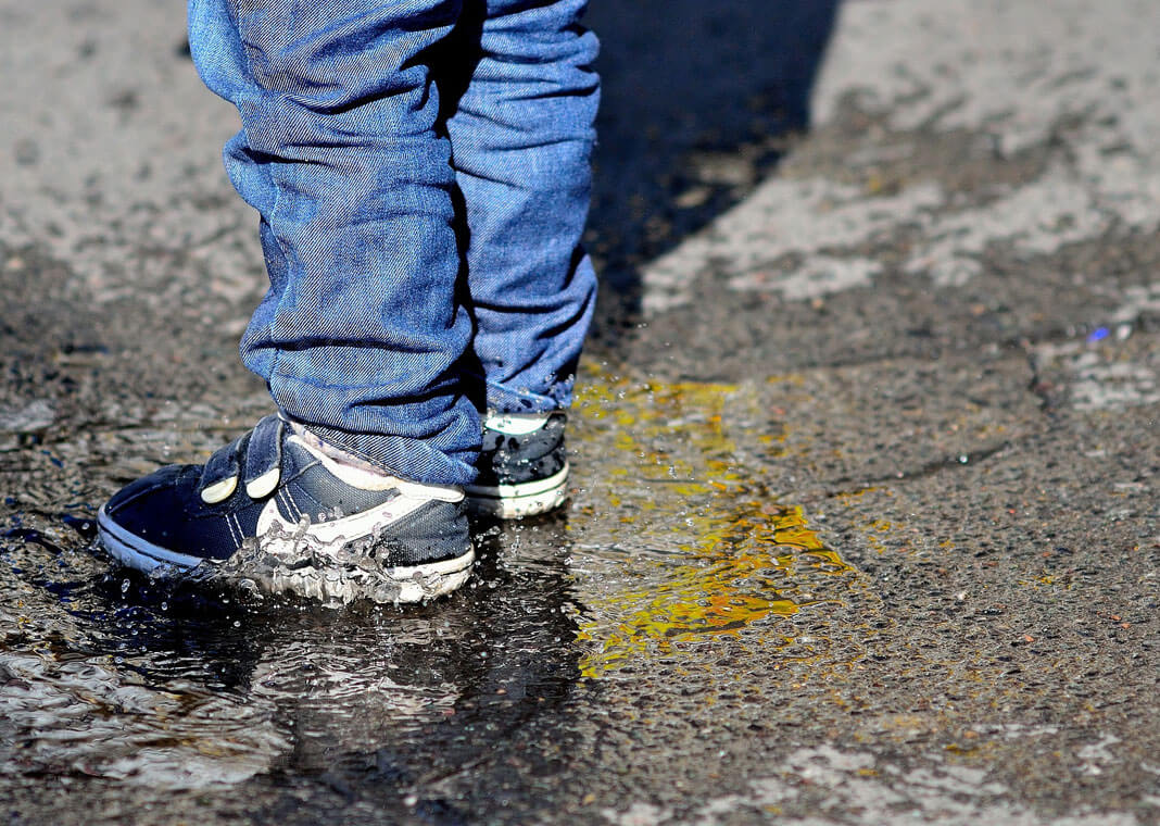 child standing in puddle - image by Lutz Holzapfel from Pixabay