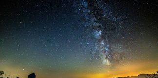 starry night with young man pondering in silence