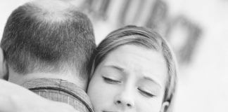 young woman hugging her father