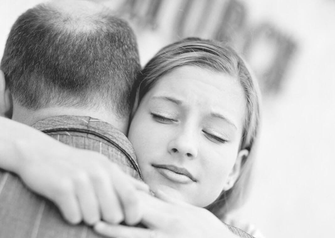 young woman hugging her father