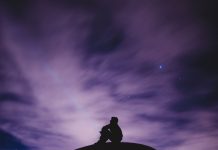 person sky gazing at purple sky