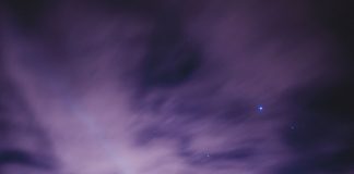 person sky gazing at purple sky