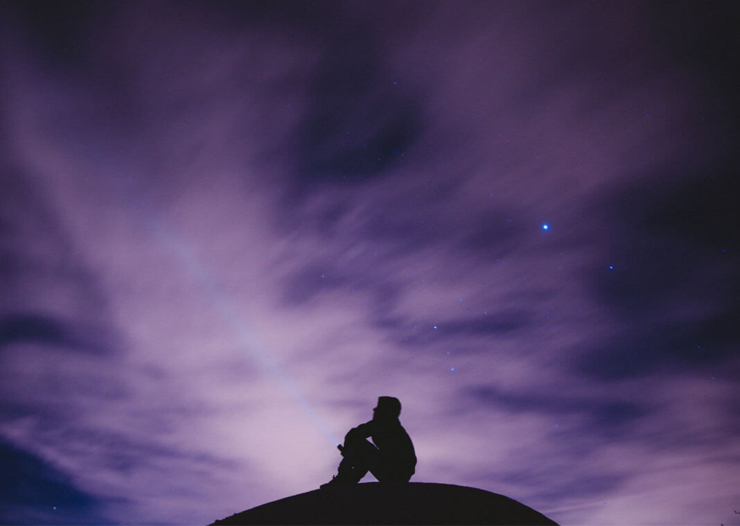 person sky gazing at purple sky