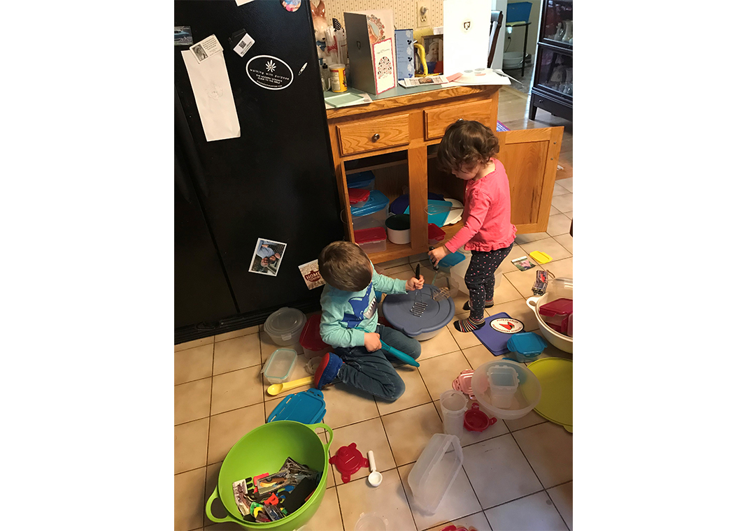 kids playing in kitchen - photo by Peggy Weber