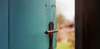 blue open door - photo by Jan Tinneberg on Unsplash