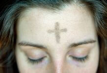 ashes on woman's forehead