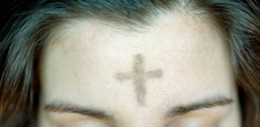 ashes on woman's forehead