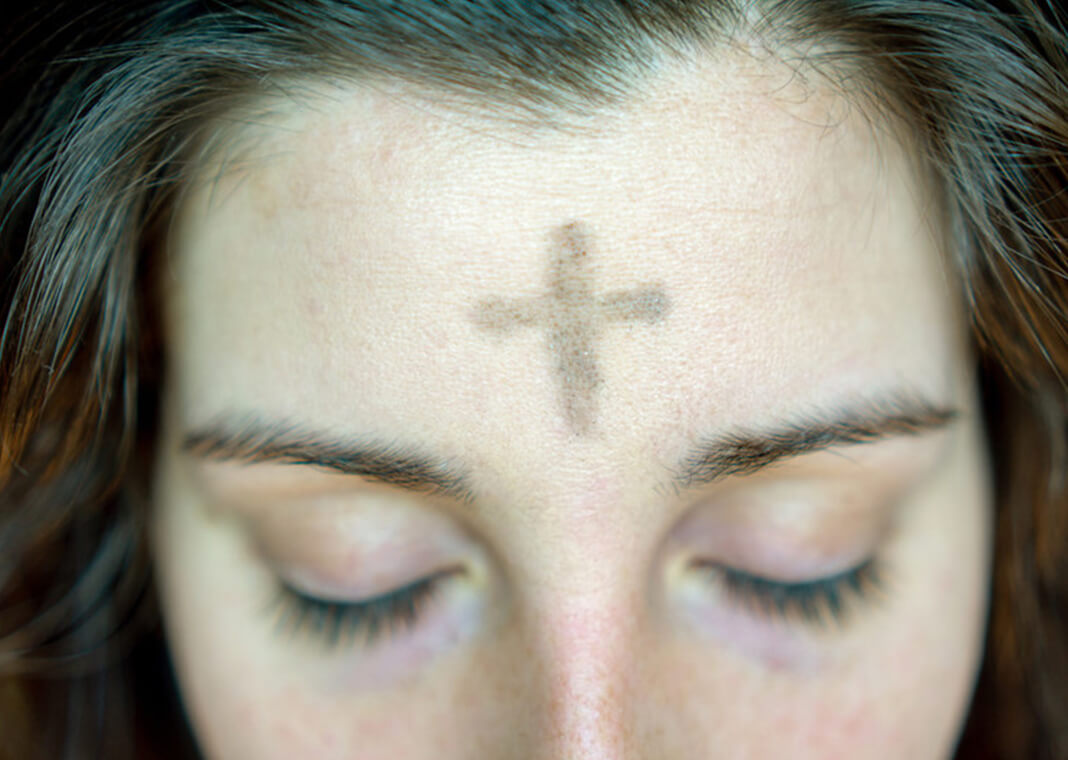 ashes on woman's forehead