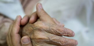 holding hand of an elderly relative