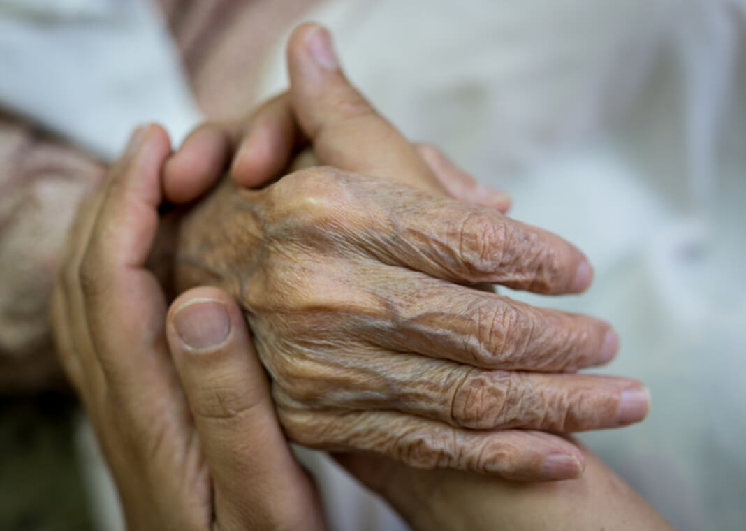 holding hand of an elderly relative