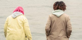 women in jackets walking outside together - photo by John Diez from Pexels