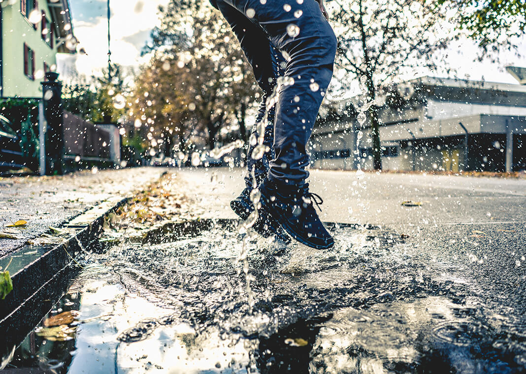 leaping into puddle - photo by Raphael Schaller on Unsplash