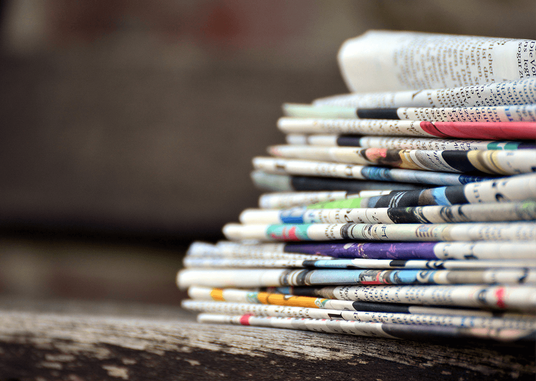 stack of newspapers - image by congerdesign from Pixabay