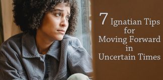 woman looking uncertainly out window - photo by Liza Summer from Pexels - text: 7 Ignatian Tips for Moving Forward in Uncertain Times