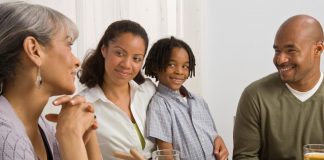 family at dinner table - photo by Creatas/Jupiterimages/Getty Images