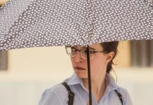 young woman with umbrella - photo by Bicanski on Pixnio