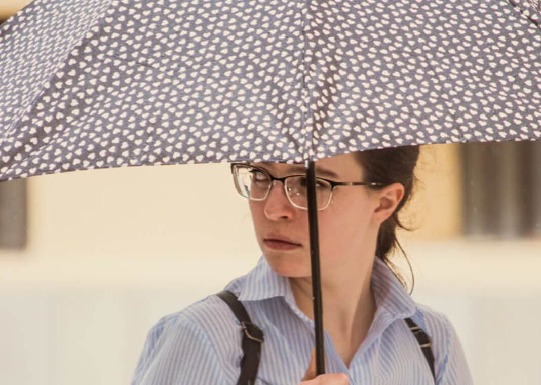 young woman with umbrella - photo by Bicanski on Pixnio