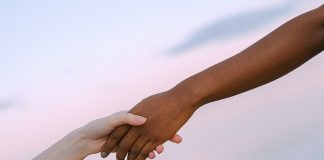 holding hands in friendship - photo by Anna Shvets from Pexels