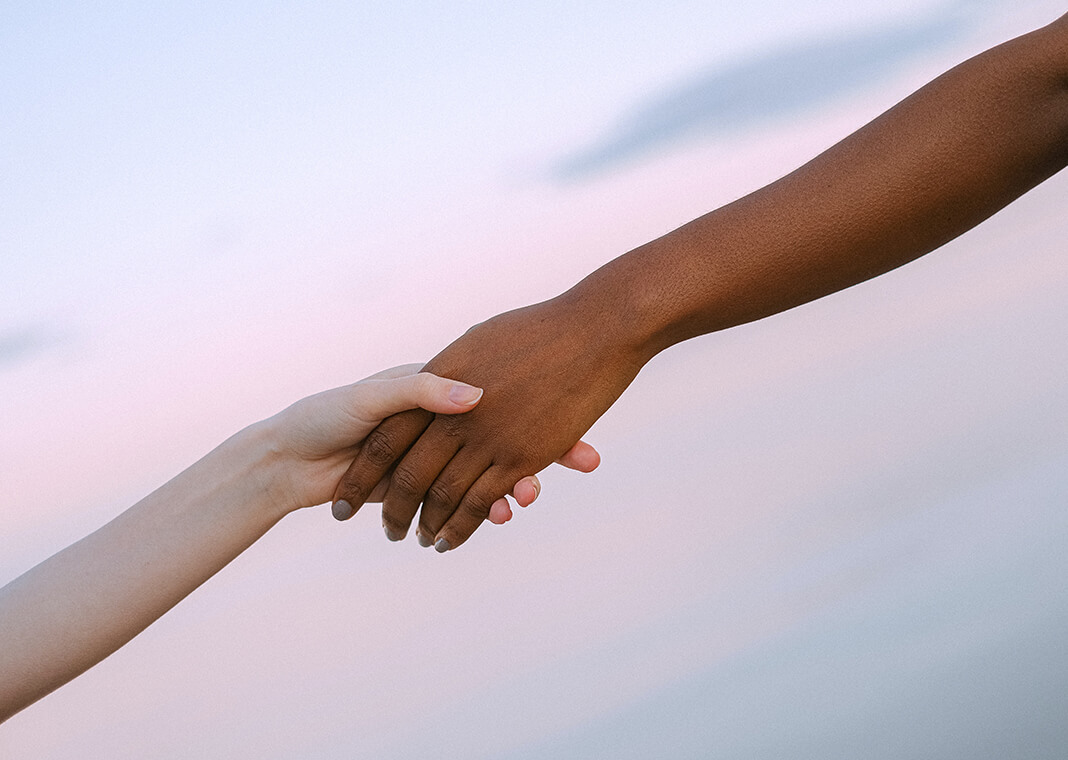 holding hands in friendship - photo by Anna Shvets from Pexels