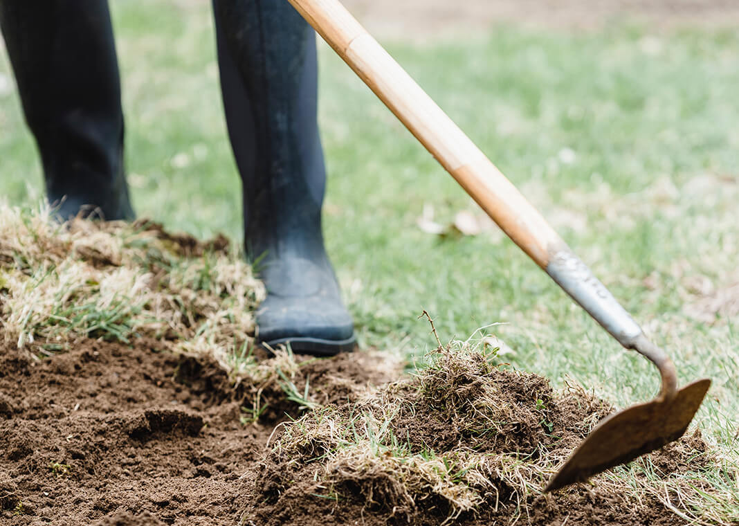gardening - turning the soil with garden hoe - photo by Greta Hoffman from Pexels