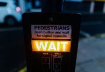 wait pedestrian sign - photo by Kelly L from Pexels