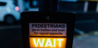 wait pedestrian sign - photo by Kelly L from Pexels