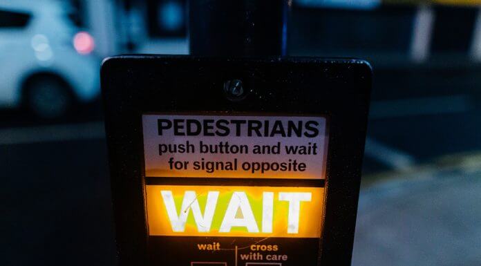 wait pedestrian sign - photo by Kelly L from Pexels
