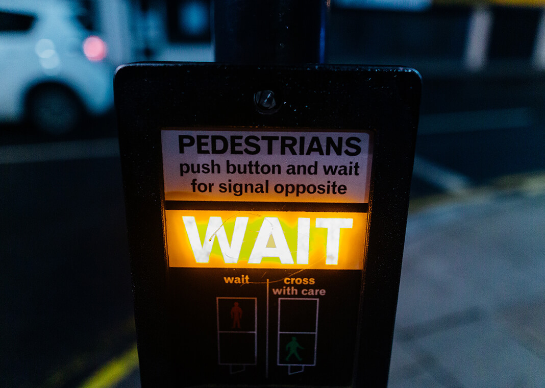 wait pedestrian sign - photo by Kelly L from Pexels