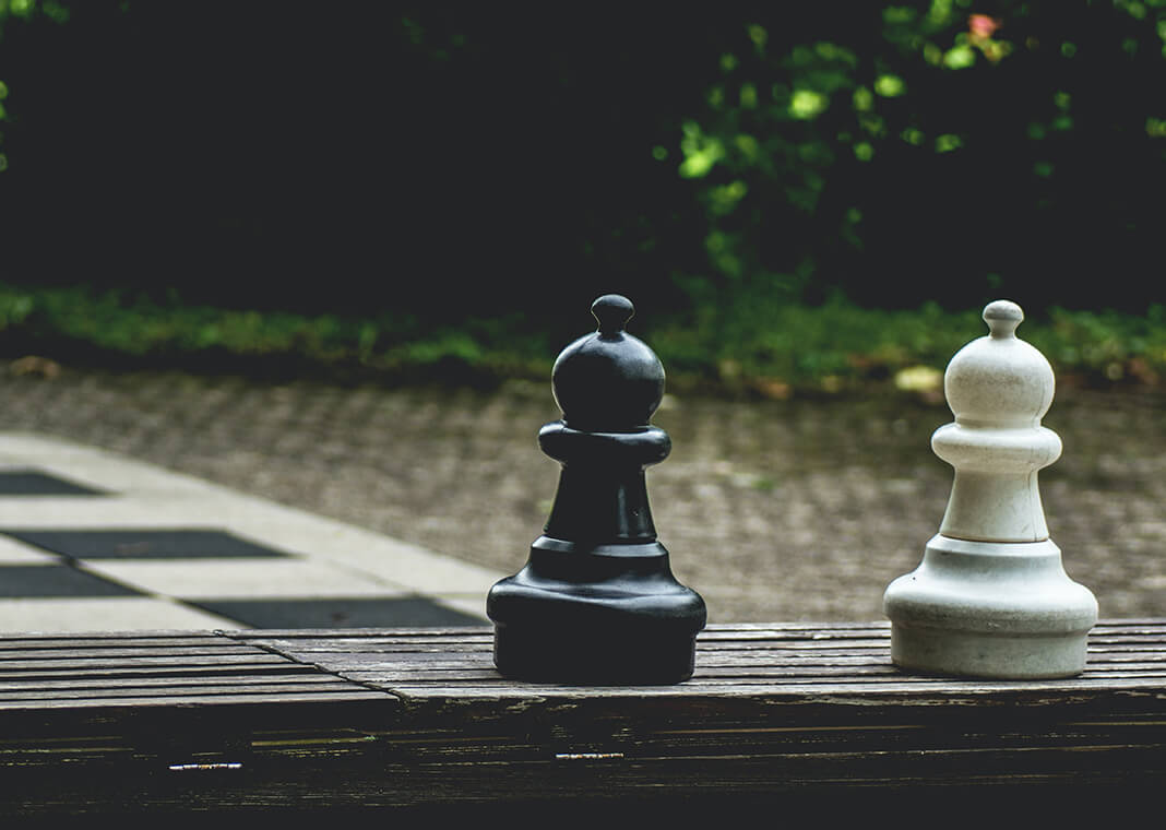 chess pieces - photo by Artur Roman via Pexels