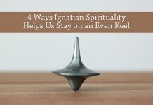 4 Ways Ignatian Spirituality Helps Us Stay on an Even Keel - text over photo of balanced top by Christophe Hautier on Unsplash