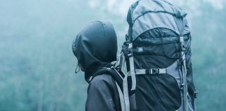 hiker with backpack in foggy weather - photo by Lalu Fatoni on Pexels