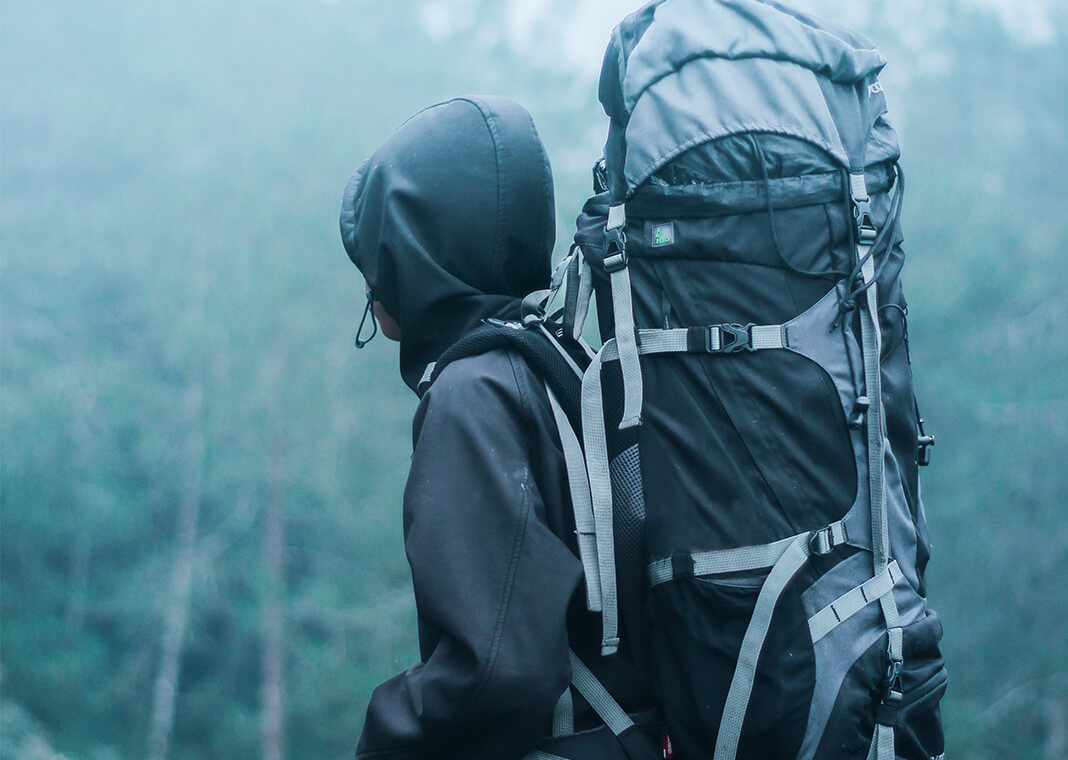 hiker with backpack in foggy weather - photo by Lalu Fatoni on Pexels