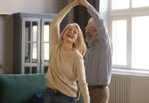 joyful couple dancing - fizkes/Shutterstock.com