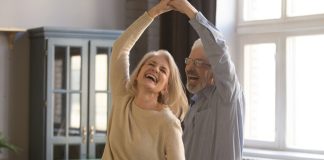 joyful couple dancing - fizkes/Shutterstock.com