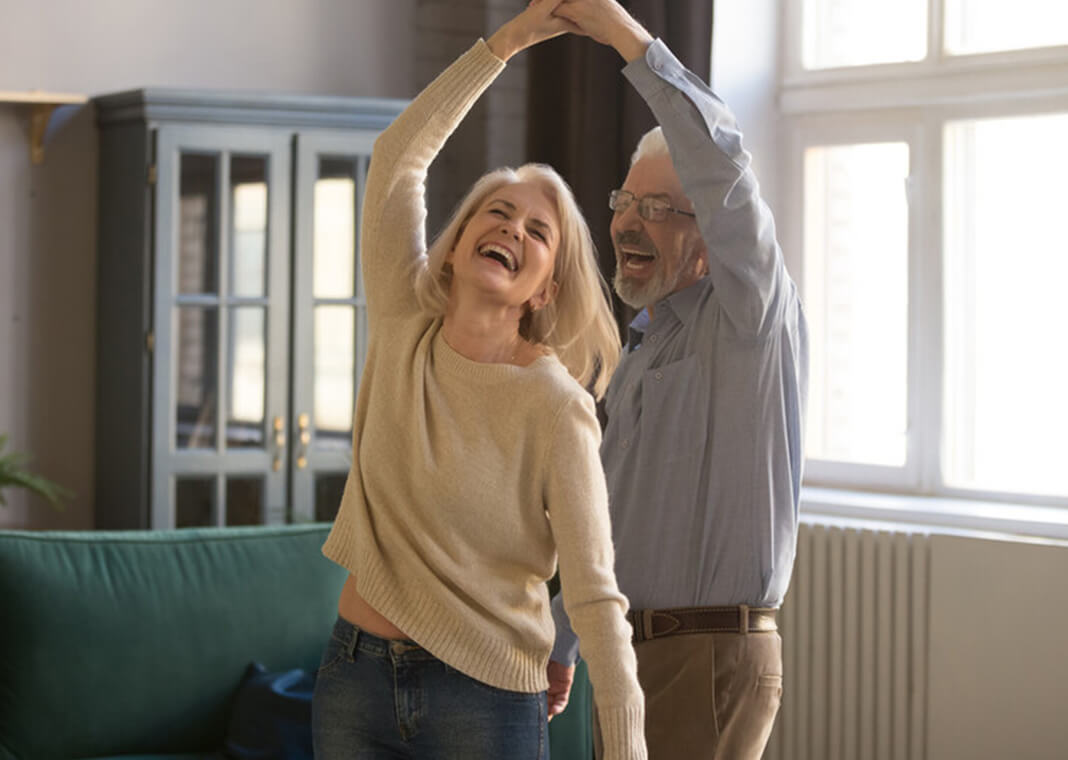 joyful couple dancing - fizkes/Shutterstock.com