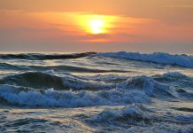 ocean waves at sunset - photo by Sascha Thiele on Pexels.com