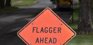flagger ahead sign - image by OlinEJ from Pixabay