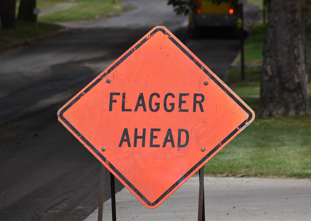 flagger ahead sign - image by OlinEJ from Pixabay