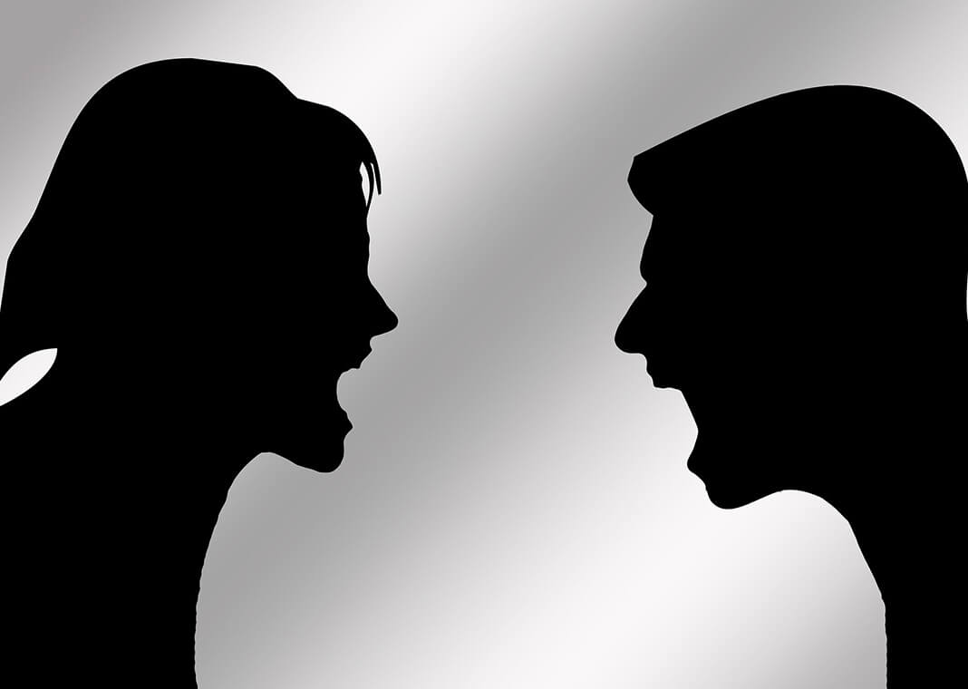 silhouettes of man and woman screaming at each other - image by Gerd Altmann from Pixabay