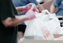 volunteers packing food - photo by Joel Muniz on Unsplash