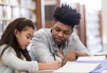 teen tutor works with elementary student / SDI Productions/E+/Getty Images