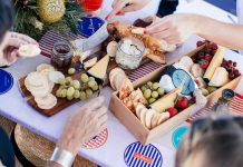 cheese and fruit on picnic table seen from above - photo by Rachel Claire via Pexels