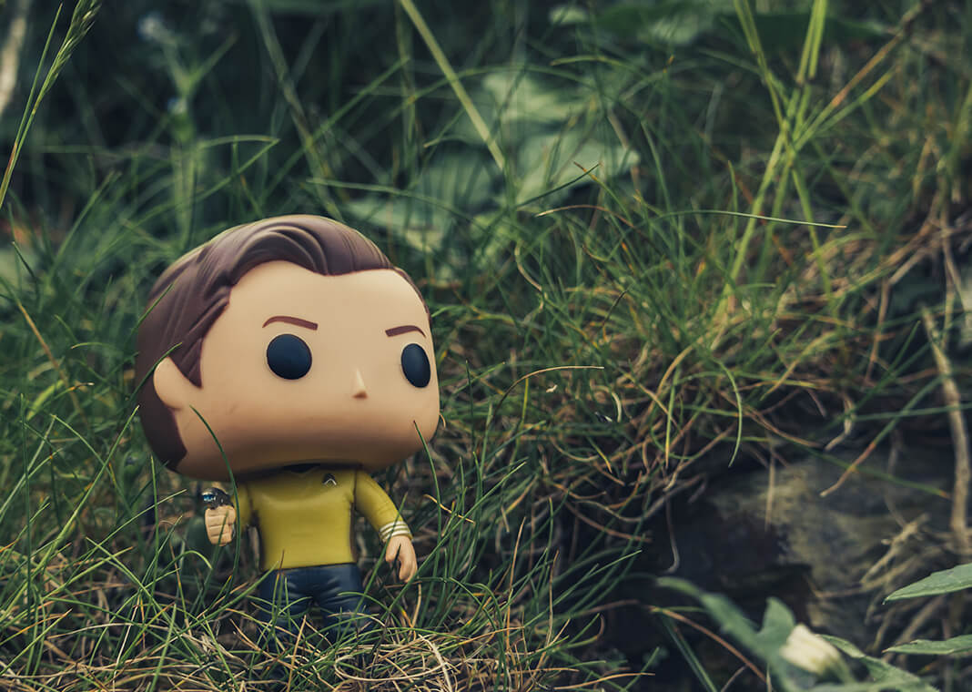 Star Trek figure in grass - photo by Dom Talbot on Unsplash 