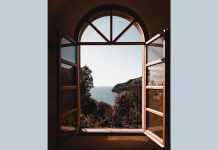 window overlooking sea - photo by Alessio Cesario on Pexels